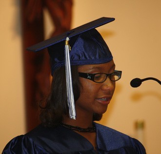 Valedictorian Yarisbeth Bradfield speaks to her classmates.