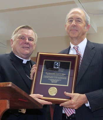 Archbishop Thomas Wenski awards the "Lex Christi, Lex Amoris" award to Appellate Judge Vance Salter for his pro-bono work when he was an attorney