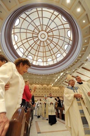 Bishop Felipe Estevez processes into St. Joseph Church in Jacksonville for his installation Mass as the 10th bishop of the Diocese of St. Augustine.