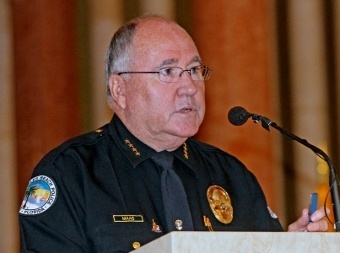 Sunny Isles Police Chief Fred Maas, a key organizer of the Blue Mass and a former classmate of Archbishop Thomas Wenski, addresses those in attendance. He presented a model of a police car to St. Patrick Church's pastor, Father Roberto Cid.