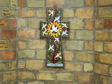 This colorful cross marks the center point of perhaps the only monument in Haiti built to honor the victims of the Jan. 12 earthquake. The monument, which somewhat resembles the Vietnam Memorial with its walled design, is located at the heavily damaged St. Louis King of France Parish in Port-au-Prince.