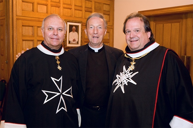 Knights of Malta take part in an archdiocesan Mass at St. Mary Cathedral in December 2011. From left: Mark Wolff, Father Patrick O'Neill, and Dr. Jose Centurion.