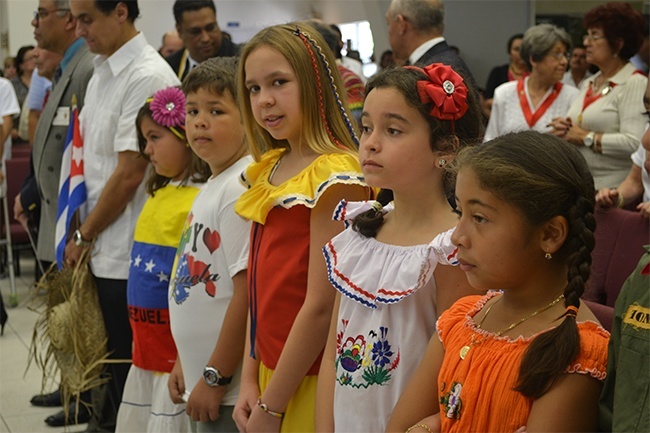 Children from the parish dressed in outfits representative of the different countries in North and South America.
