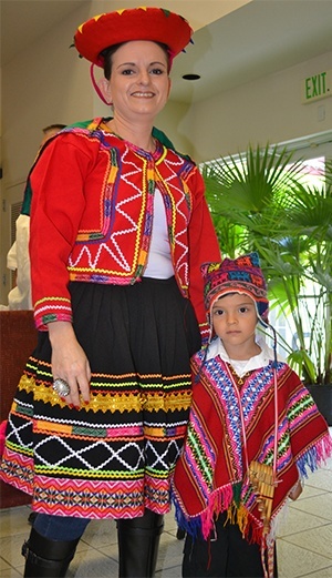 Colorfully-clad mother and son Lina Maria Restrepo and Juan Felipe Sanchez, 4, represented Peru in the procession.