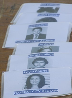 The ID cards of Florida City alumni, depicting them when they arrived in the U.S., worn by the Pedro Pans for the ceremony.