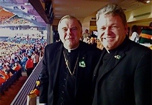 Archbishop Wenski poses for a photo with Msgr. Michael Carruthers, pastor of St. Augustine Church and Catholic Student Center, which is located just across the street from the UM campus in Coral Gables.