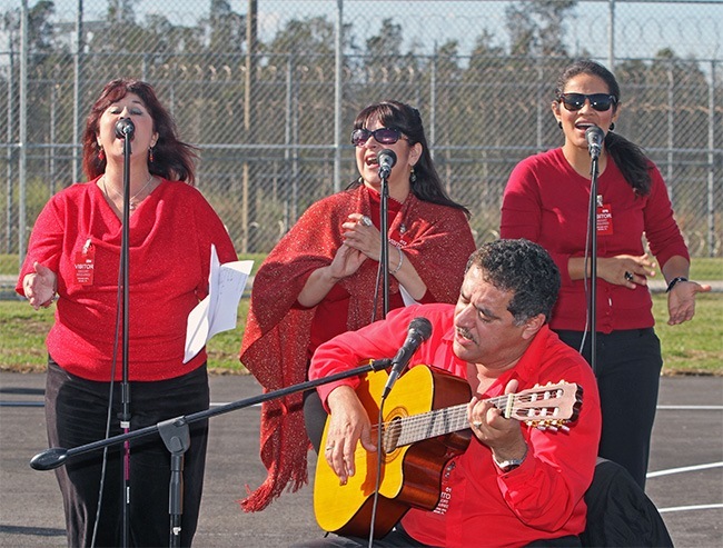 Eira Luis, Miriam Gomez, Maria Almanza and Fernando Gomez, members of Lanzando La Red music ministry at Mother of Our Redeemer Parish in Miami, sing during the Mass.