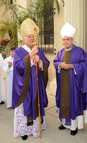 Archbishop Thomas Wenski and Bishop Felipe Estevez of St. Augustine stand outside the Cathedral Basilica of St. Augustine before the start of the Mass.