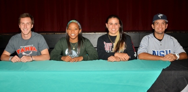Archbishop Edward A. McCarthy High School seniors participated in National Letter of Intent Signing Day Nov. 14. Pictured from left to right are: Kori Beck, Khayla Livingston, Stephanie Chaiser, and Michael Hernandez.