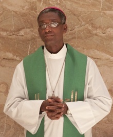 Bishop Chibly Langlois, president of the Haitian bishops conference and bishop of the Diocese of Les Cayes, prays during the Mass.