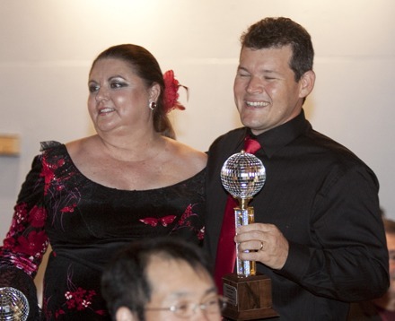 Judges' vote winners the first night, Leo Hanon of St. Katharine Drexel Parish and his amateur partner, Teresa Armand, pose with their mirrorball trophies.