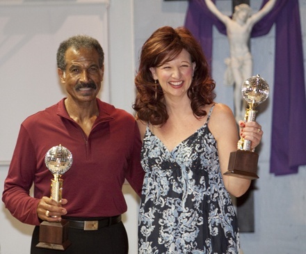 Popular vote winners two nights in a row, Bill Jackson and Cheryl Whapham, of the lay ministry office, pose with their mirrorball trophies.