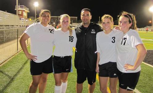 Four seniors from Archbishop Edward A. McCarthy High School participated in the tri-county Soccer-Max /Soccer-Locker Small School Senior All-Star Game; from left: Katty Pasquariello, Aubri Williamson, Coach Mike Sica, Sarah Devore and Samantha Gestido.