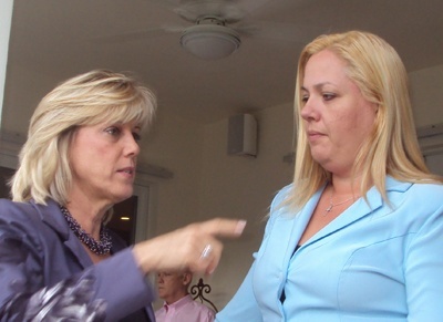 Betty Pelleya, left, president of the board of The Glory House, speaks with former sex trafficking victim Katariina Rosenblatt.