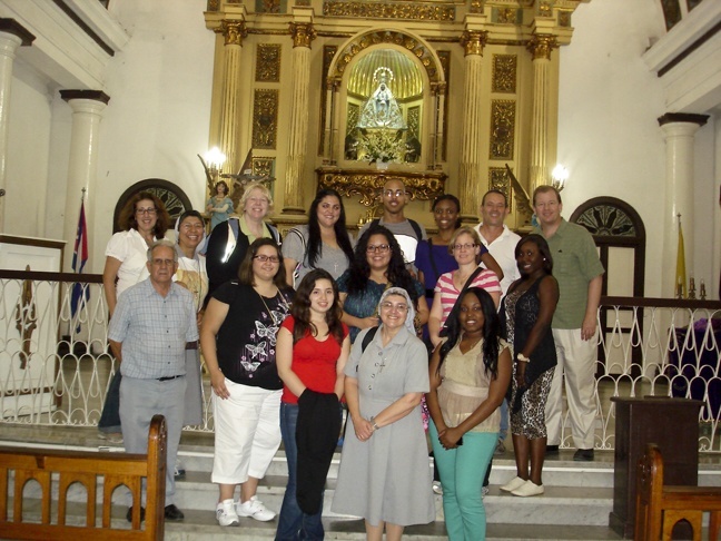 Students from St. Thomas University pose for a photo at the Church of Our Lady of Regla in Havana.