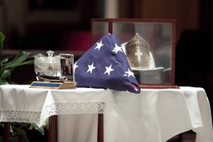 Artifacts from 9/11 occupy a prominent place on the side of the altar, including a bolt from the Twin Towers, ashes from the site, an American flag and the helmet of Franciscan Father Mychal Judge, the New York Fire Department chaplain who was the first certified victim of the attack.