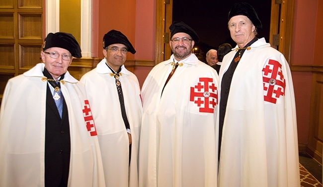 Posing for a photo wearing their traditional attire after a recent Mass at St. Mary's Cathedral, Knights of the Holy Sepulcher Sir John Dietl, Sir Dr. Jose Jaen, Sir James Kelly, and Sir Bernard Wolff.