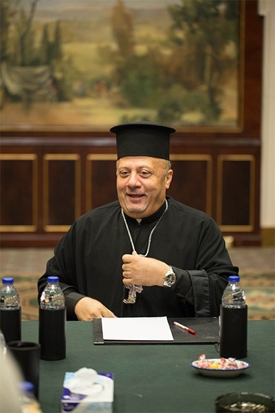 Father Nabil Haddad, director of the Jordanian Interfaith Coexistence Research Center, speaks  about the Syrian crisis and a wide range of regional concerns Sept. 25 to an ecumenical group of Christian writers and bloggers from the U.S. who were convened at a Marriott Hotel in Amman.