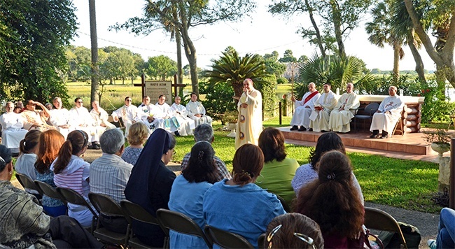 Bishop Felipe Estevez of St. Augustine speaks to Hispanic ministry leaders from throughout the southeastern U.S. during a 7 a.m. Mass at the rustic altar on the grounds of Our Lady of La Leche Shrine in St. Augustine. Historians say the site is where, in the 16th century, the first Catholic Mass was celebrated in what is now the U.S.