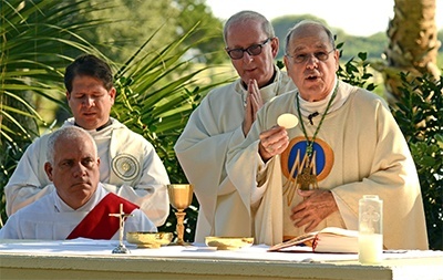 Bishop Felipe Estevez of St. Augustine is shown here during the consecration at the opening Mass for the 17th regional encuentro of Hispanic ministers from throughout the southeastern U.S. Behind him is Bishop John Noonan of Orlando. Some 150 participants were on hand representing 16 dioceses and 17 nationalities from throughout the Southeast.