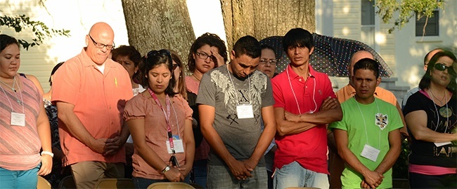 Participants in the 17th regional encuentro from Hispanic ministry take part in the early morning outdoor Mass on the grounds of the Shrine of Our Lady of La Leche in St. Augustine.