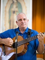 Deacon Juan Carlos Pagan, program coordinator in Hispanic Ministry for the Diocese of Lafayette, La., leads music at a SEPI-sponsored Hispanic ministry Encuentro held Oct 17-20 in St. Augustine, Fla.