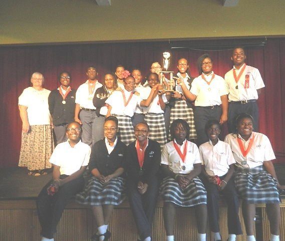 St. James won first place in the small school division at Archbishop Curley Notre Dame Preps 21st Annual Academic Olympics. Pictured from left, first row: Talia Magiste, Victoria Ospin, Kelsey Rosier, Abigail Hilaire, Tontyana Francoeur, Gabrielle Russell; second row: Sister Stephanie Flynn, SJS, Daffkine Pierre, John Moore, Daphney Dalge, Anabelle Ternier, Fabian Saint Juste, Mikeiveka Sanon, Kimberly Vilbrun, Victoria Santiago, Gianni Domond, Leticia Dass, Teddy Latortue.