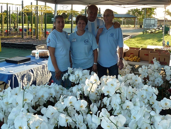 From left: Fabiola Vidales, Isabel Font, Luis Font, and Gustavo Bergnes, who helped the St. Vincent de Paul Society's Friends of the Poor Walk/Run by donating orchids.