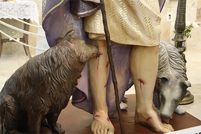 Detail of the dogs licking the sores of Lazarus the beggar in the image now housed at San Lazaro Church in Hialeah.