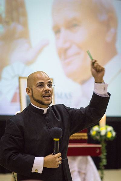 Father Luis Rivero, Miami archdiocesan director of campus ministry helps lead a Nov. 5 youth rally In Honor of Blessed John Paul II at St. Thomas University in Miami.