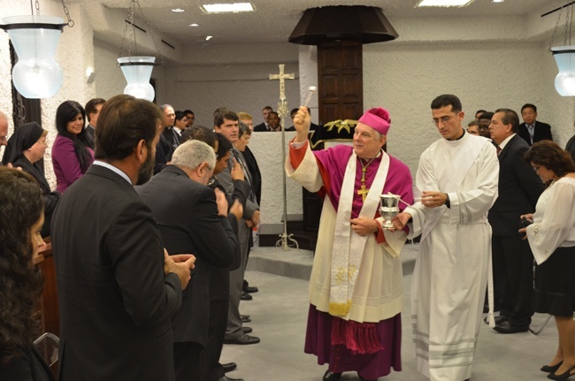 Archbishop Thomas Wenski blesses all those present at the dedication of the chapel.