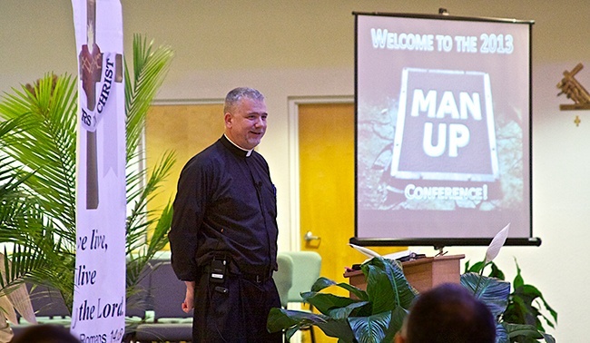 Father Larry Richards speaks to the men attending the "Man Up!" conference held at St. Edward Parish in Pembroke Pines.