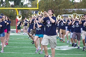 The marching band for the Fightin' Irish rehearse their performance of the theme song from "Back to the Future" on the football field at Cardinal Gibbons High School.