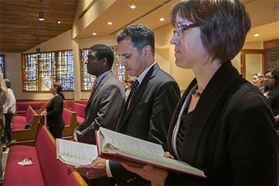 PROCHE members take part in the Mass, from left: Stephan Destin of PROCHE's construction unit; Jacques Liautaud, the U.S. bishops' project manager for the Church in Haiti; and Margit Wichelmann of Adveniat, the German bishops' foreign aid organization.