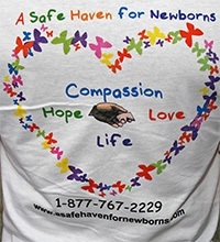 A t-shirt bears the logo of A Safe Haven For Newborns, established by Christ the King parishioner Nick Silverio in memory of his wife, Gloria.