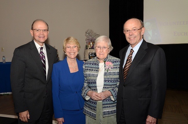 From left: Holy Cross Hospital President and CEO Patrick A. Taylor, Holy Cross Director of Volunteer Services Abbie Klaits, Holy Cross Volunteer of the Year Shirley Healy, and Holy Cross President Emeritus John Johnson pose for a photo during the awards luncheon.