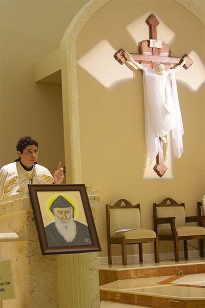 A portrait of St. Charbel sits on the altar in honor of his feast day, July 26, at Our Lady of Lebanon Maronite Catholic Church in Miami.