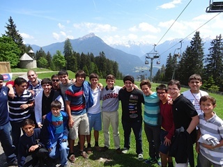 Members of the overseas study group get ready to head down the 2.5-mile Alpine Coaster on a spectacular day in Austria.