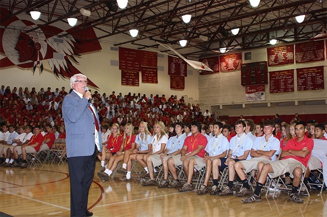 Paul Ott, seen here addressing an assembly at his alma mater, has only been away from Cardinal Gibbons High School for the four years he attended the University of Notre Dame.
