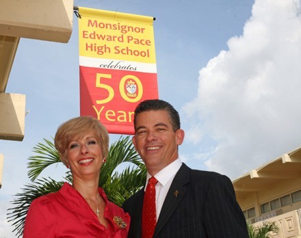 Ana Garcia, current principal at Msgr. Edward Pace High School, poses with her husband, Eddy, until this year principal of his alma mater, Immaculate Conception School in Hialeah. The two met at Pace and are members of the 1980 graduating class.