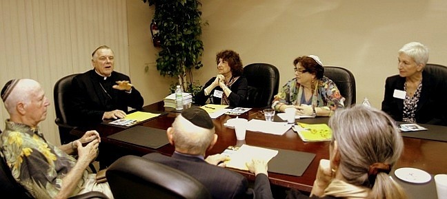 Archbishop Thomas Wenski welcomes the members of MCCJ at the Pastoral Center. Clockwise from the top left: Archbishop Wenski, Roberta Shevin, Rabbi Cheryl Weiner, Diane Shoaf, the Rev. Audrey Bloom, Rabbi Solomon Schiff, and Rabbi Ralph P. Kingsley.