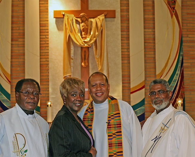 Posing for a photo during a break on the first night of the revival, from left: Father Alexander Ekechukwu, administrator of Holy Redeemer Parish in Liberty City; Katrenia Reeves-Jackman, director of the Office for Black Catholic Ministry; Father Anthony Bozeman; and Deacon Thomas Dawson of St. Philip Neri Parish.