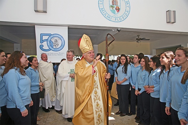 Archbishop Thomas Wenski waves to Lourdes Academy students after celebrating Mass and blessing new school facilities.
