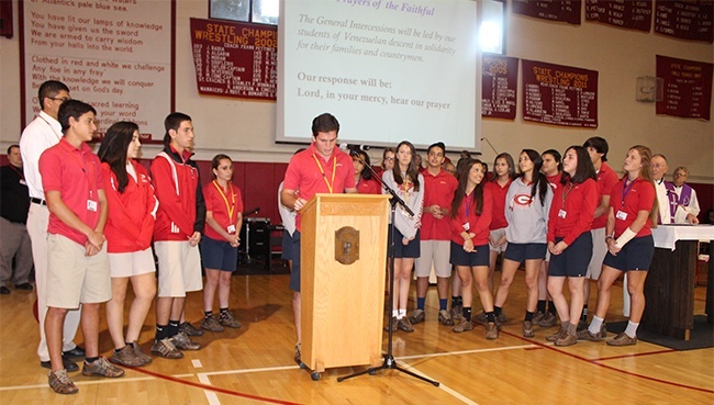 Venezuelan students at Cardinal Gibbons High School lead the Ash Wednesday prayer service. At the podium is Nicholas Ketchum.