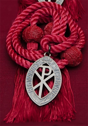 Medal received by altar servers who join the Guild of St. Stephen is hung from a thick red cord symbolizing the martyrdom of St. Stephen.