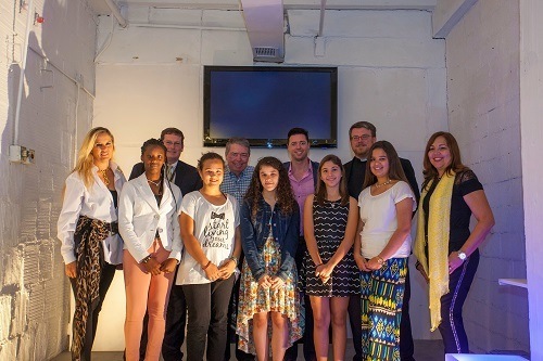 Posing at the First Friday Art Walk, back row, from left: Elvira Aeda Dago, McCormick Place curator; Douglas Romanik, Curley Notre Dame principal; Edward McCormick, Sr. and Sean McCormick, McCormick Place owners; Christian Brother Jason Ford, admissions director at ACND. Front row, from left: Rebecca Jean, St. Rose; Samara Gustafson, Brother Rice Honors Academy; Elizabeth Rivera, St. Mary; Alexandria Celaya, St. Peter and Paul; Astrid Savaresse, St. Patrick; Julie Martinez, advancement assistant at ACND. Not pictured - Gabriela Perez-Robles, Our Lady of the Lakes.