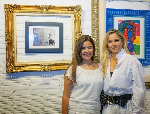 Alexandria Celaya stands with Elvira Aedo Dago, McCormick Place curator, in front of her winning photograph titled "Thinking of You."
Dago is alumna of Immaculata-La Salle High School and Sts. Peter and Paul School in Miami.