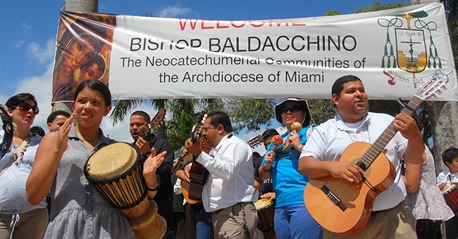 Members of the Neocatechumenal Way play exuberantly before the ordination ceremony for Bishop Peter Baldacchino, himself a member of the group.