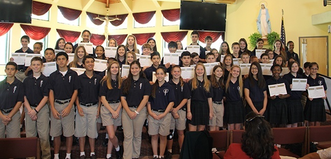 Inductees into Mary Help of Christians School's Junior National Honor Society pose for a photo.