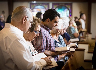 Members of the congregation pray March 2 at Heart of Jesus Maronite Church in Fort Lauderdale.